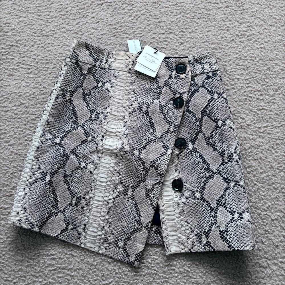 Brand New with tags snakeskin print mini with asymmetrical cut!